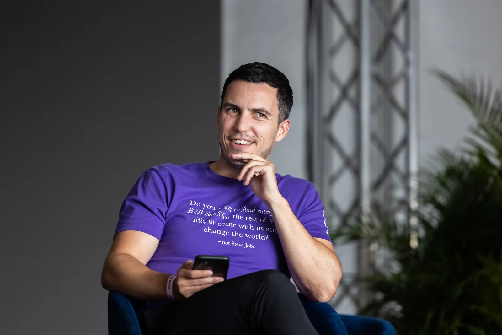 An attendee in a "Funding the Commons" t-shirt, mid-conversation.
